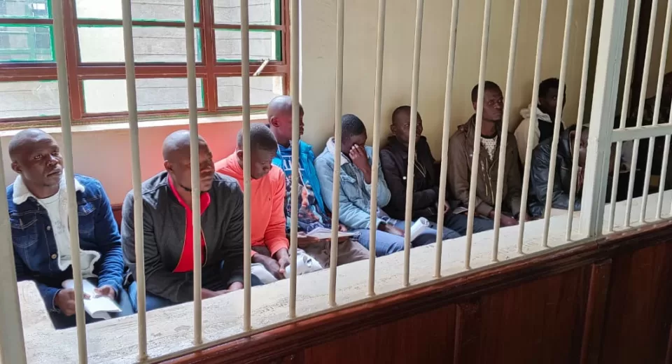 Photo of Kennedy Oluoch, Nicholus Otieno, Tofiq Owiti Mohammed, Michael Omondi Opiyo, David Bill Clinton Otieno, Samuel Ouma, Robert Ouko Abala, and Erick Obunga Osumba in Court
