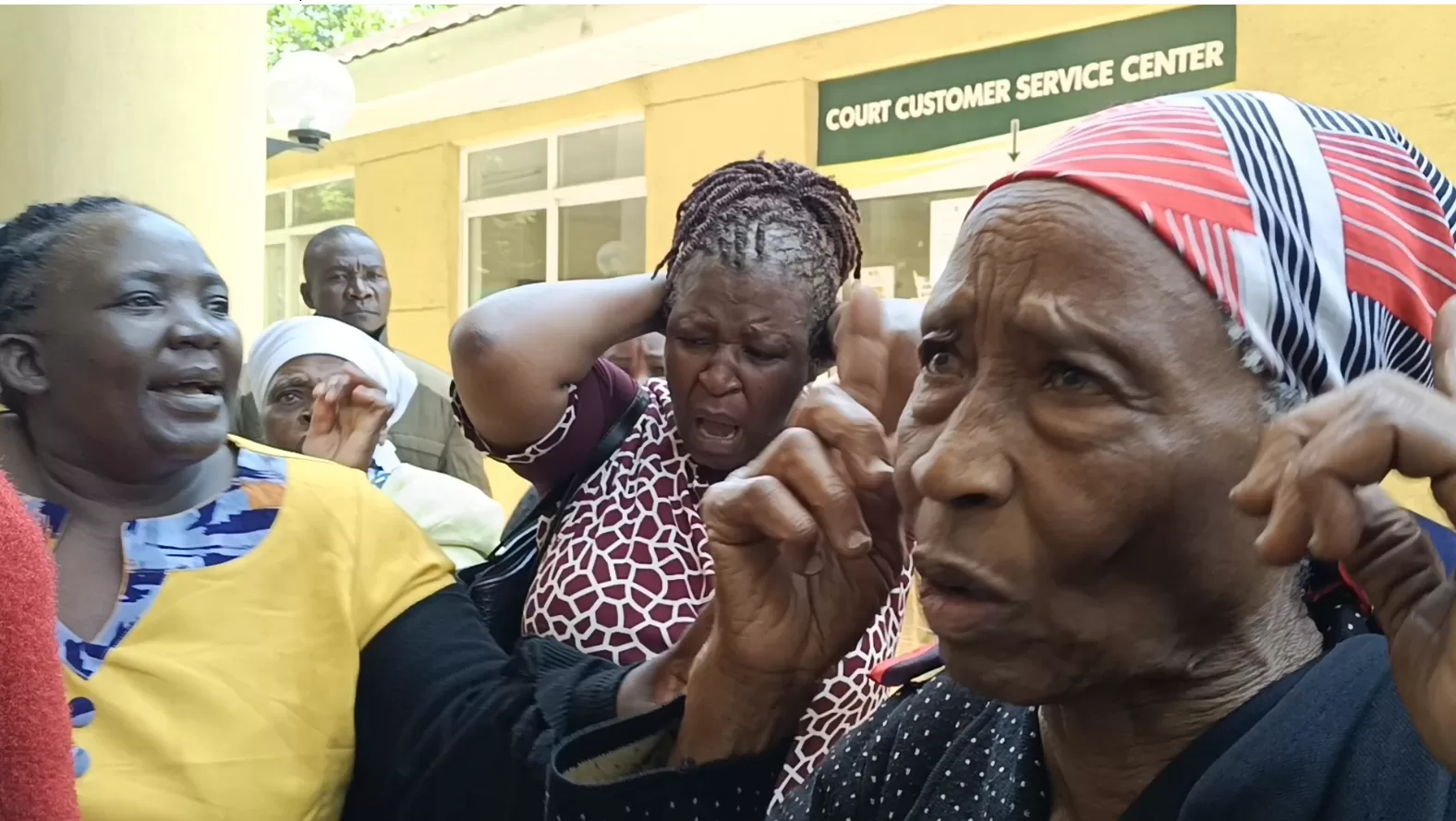 Photo of members of Wilson Mitumba Women Group staging a protest outside Milimani Law Courts