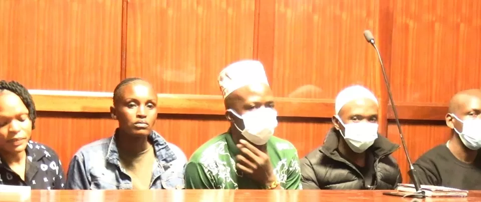 Photo of Erick Muyera, Raphael Kimani, Mustapha Kimani, Stephen Astiva, Jane Wanjiru, Margaret Njeri and Simon Wambugu in Court