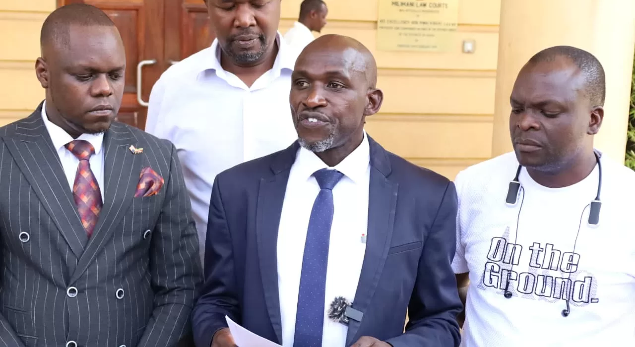 Tony Gachoka and Fredrick Onyango Ogola outside Milimani Law Courts